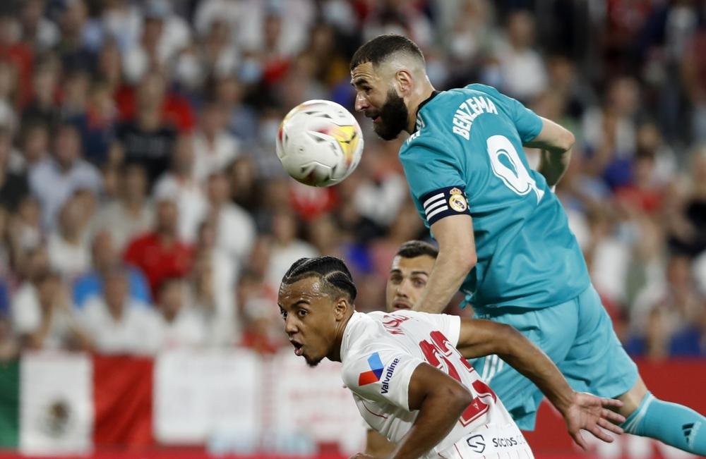 Benzema rallies Madrid past Sevilla, closer to league title